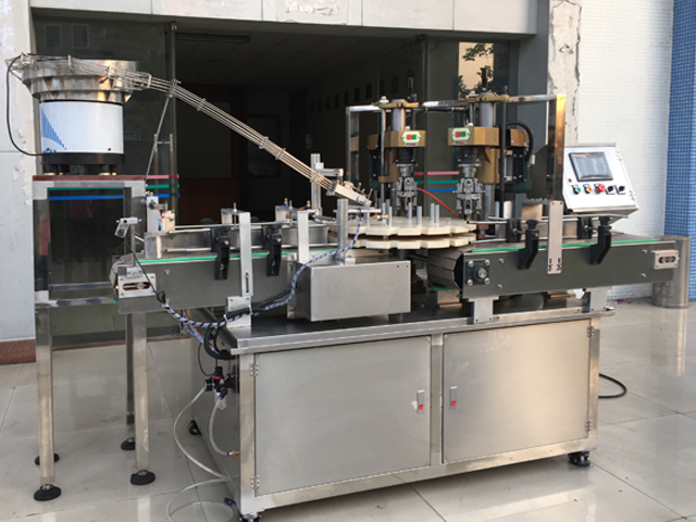 capping machine with 2 capping heads vidalı kapaklama ekipmanı yarı otomatik.jpg