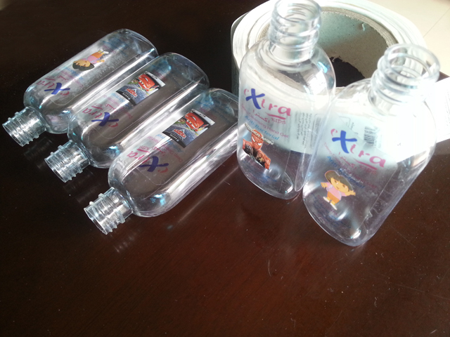 transparent labels labelled samples bottles plane surface Mrwan örnek şeffaf etiketler ve şişeler (3).jpg